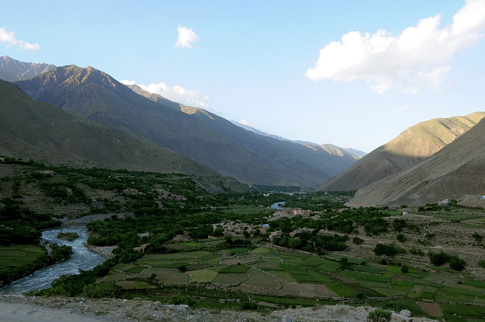 The green Panjshir valley in spring, with the river, fields and mountains of the Hindu Kush